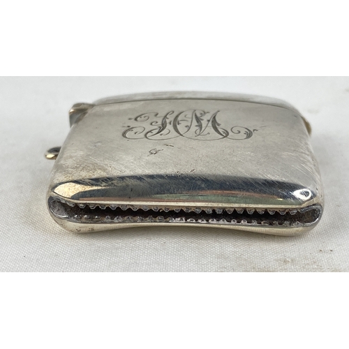 199 - A Sterling silver vesta case with initialled front.