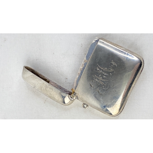 199 - A Sterling silver vesta case with initialled front.