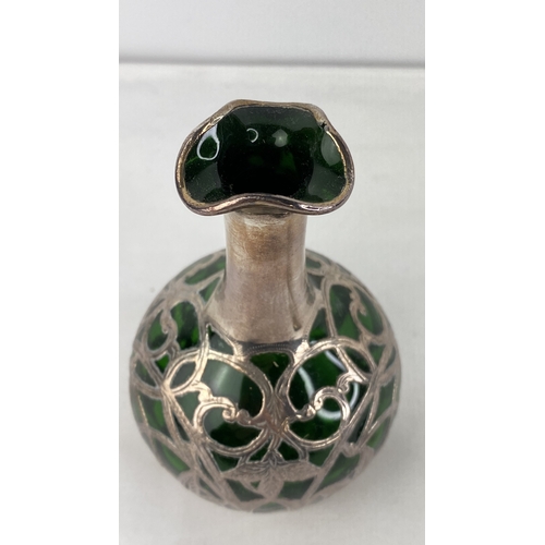 201 - A Sterling silver and green glass perfume bottle (stopper a/f).