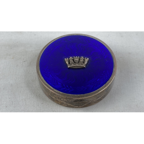 204 - A stunning Sterling silver and blue enamel pill box with crown detail, total weight 32g.