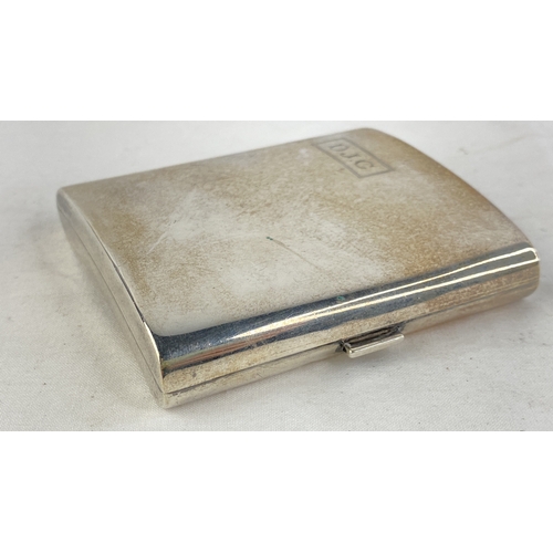 206 - A Sterling silver cigarette case engraved D.J.C, weight 127g.