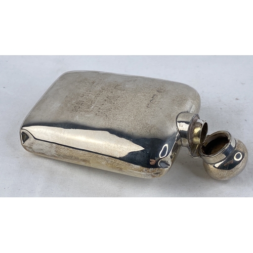 208 - A Sterling silver presentation hip flask, weight 117g.