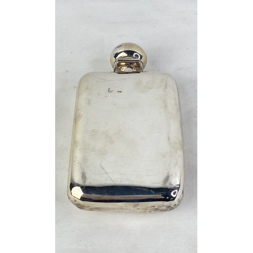 208 - A Sterling silver presentation hip flask, weight 117g.