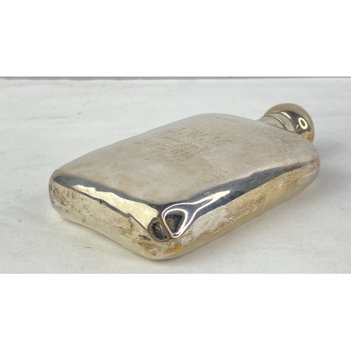 208 - A Sterling silver presentation hip flask, weight 117g.