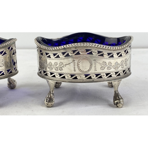 210 - A stunning pair of antique Sterling silver jam pots with blue glass liners.