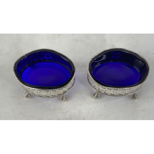 210 - A stunning pair of antique Sterling silver jam pots with blue glass liners.