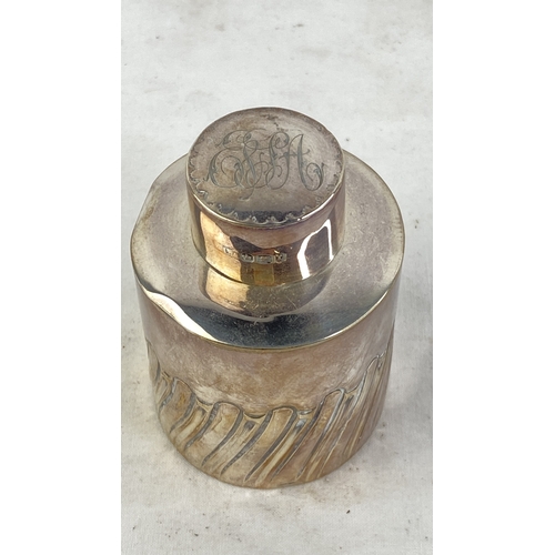 213 - A Sterling silver perfume bottle with engraved top, weight 74g.