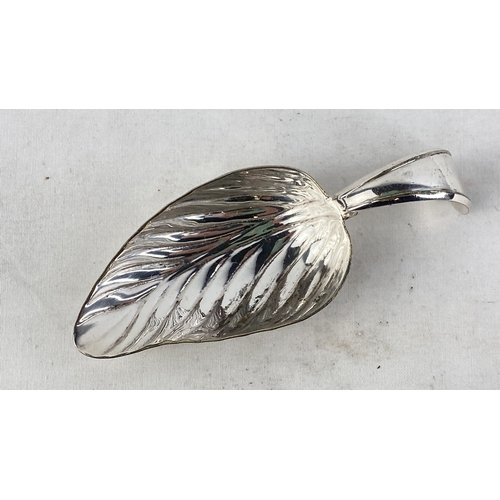 214 - A Sterling silver caddy spoon in the shape of a leaf, weight 25g.