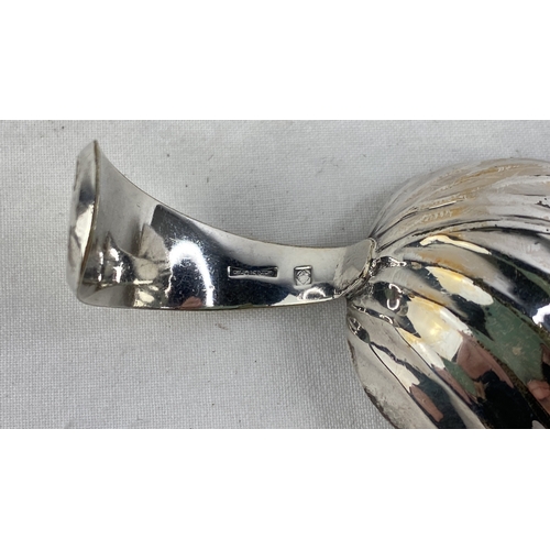 214 - A Sterling silver caddy spoon in the shape of a leaf, weight 25g.