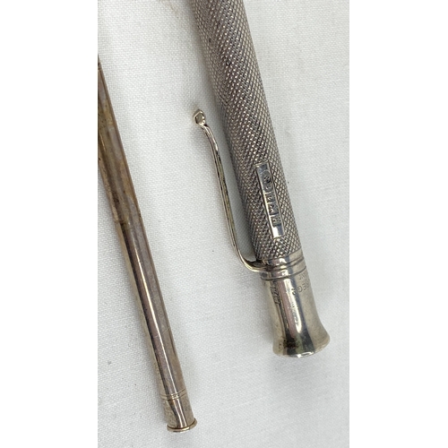 216 - A Sterling silver propelling pen and pencil, total weight 33g.