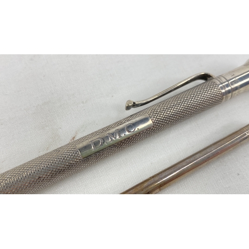 216 - A Sterling silver propelling pen and pencil, total weight 33g.