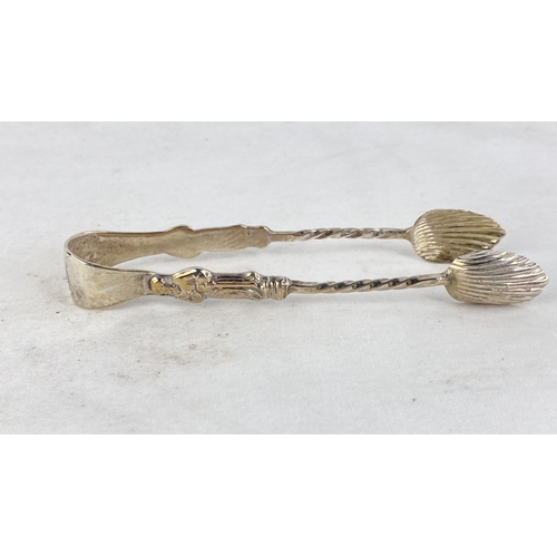 219 - A set of Sterling silver Apostle design sugar tongs, weight 12.5g.