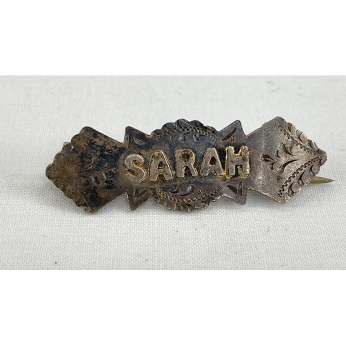 224 - An antique silver sweetheart brooch 'Sarah'.