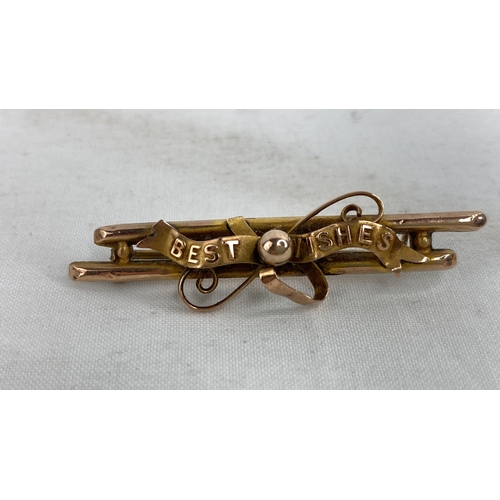 226 - A 9ct gold 'Best Wishes' brooch.