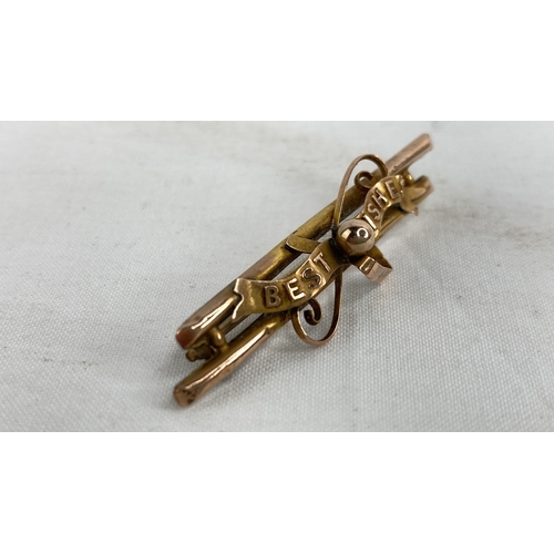 226 - A 9ct gold 'Best Wishes' brooch.