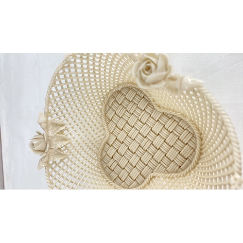 227 - A Belleek pottery four strand basket with rose detail (a/f).