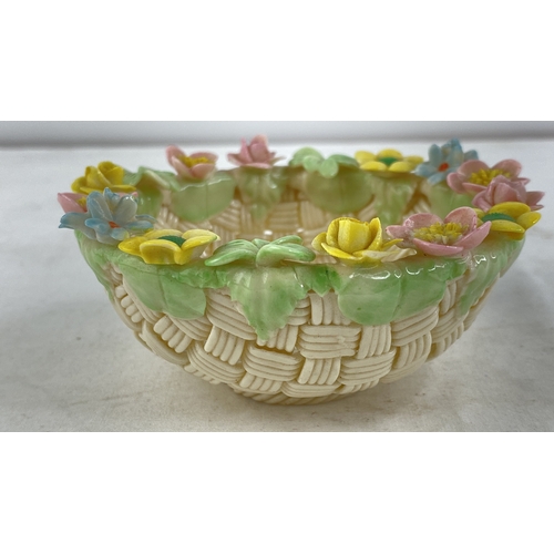 229 - A Belleek pottery four strand floral basket (a/f).