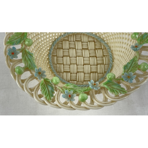 230 - A Belleek pottery four strand floral basket (a/f).