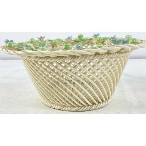 230 - A Belleek pottery four strand floral basket (a/f).