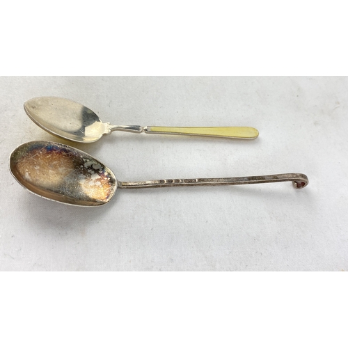 244 - A stunning Sterling silver and enamel handled spoon and another.