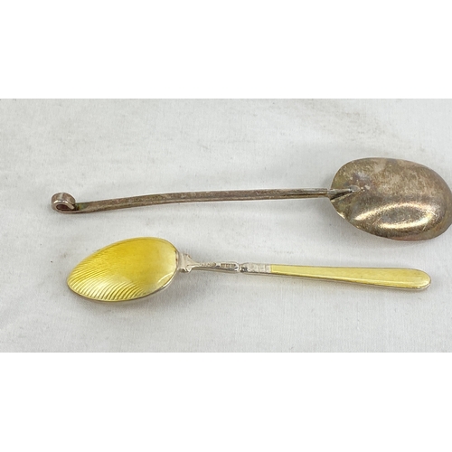 244 - A stunning Sterling silver and enamel handled spoon and another.