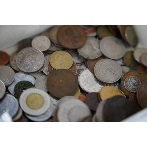 251 - Two commemorative coins sets and a lot of assorted coinage.