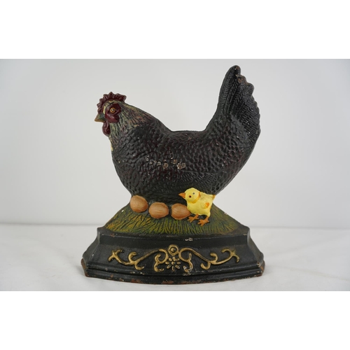 274 - A cast iron doorstop in the style of a hen.