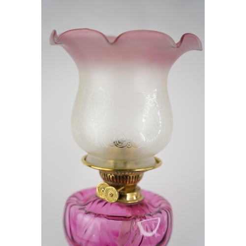 276 - A stunning antique ruby glass font oil lamp and etched glass shade.