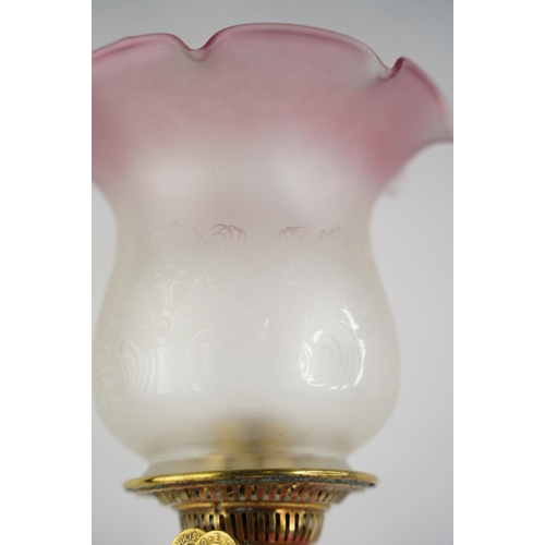 276 - A stunning antique ruby glass font oil lamp and etched glass shade.