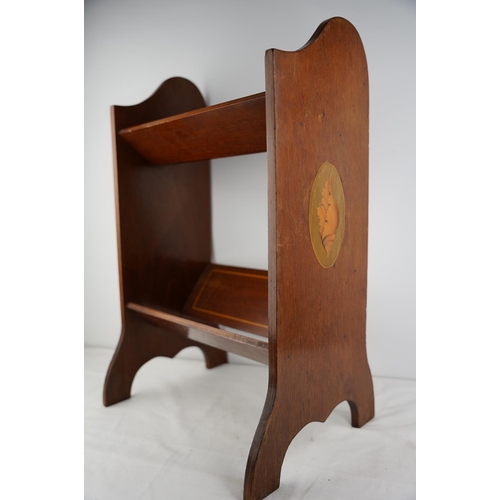 285 - An antique mahogany and inlay shell design book stand.