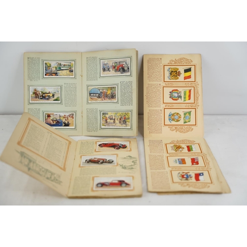 295 - Two vintage John Player & Sons cigarette card albums and another by W D & H O Wills.