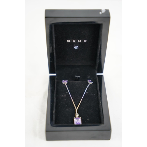 302 - A Sterling silver and amethyst necklace and earring set.