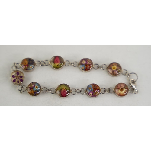 311 - An unusual bracelet with floral design segments,