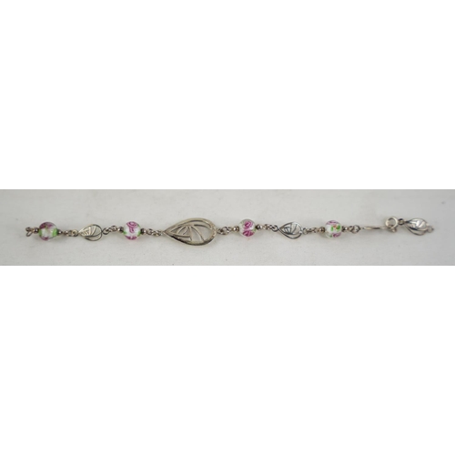 314 - An unusual bracelet with floral design segmens.