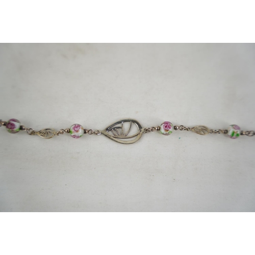 314 - An unusual bracelet with floral design segmens.