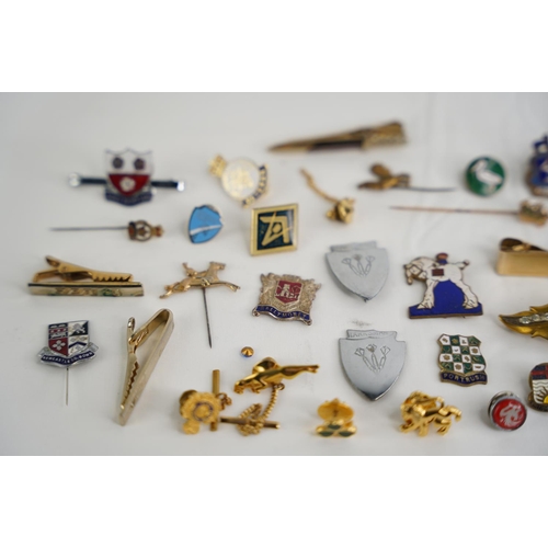 332 - A large collection of vintage badges etc.