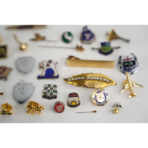 332 - A large collection of vintage badges etc.