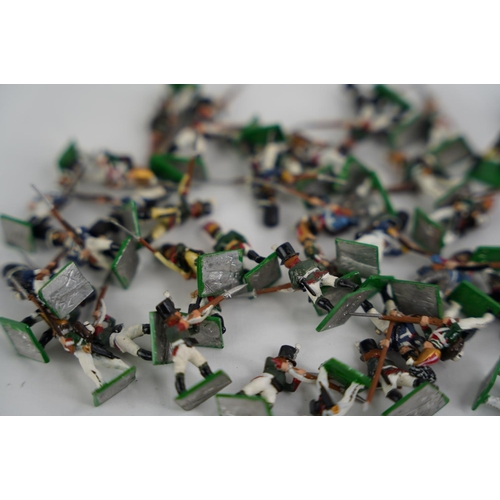 334 - A collection of approximately 50 hand painted miniature metal figures.