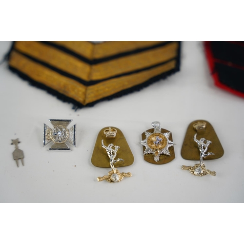 341 - An assortment of various items to include Military badges, patches & more.