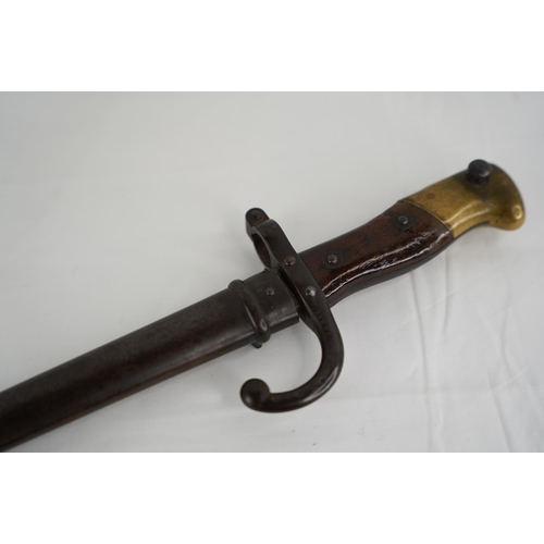 348 - An antique French 1881 Bayonet in original metal scabbard.