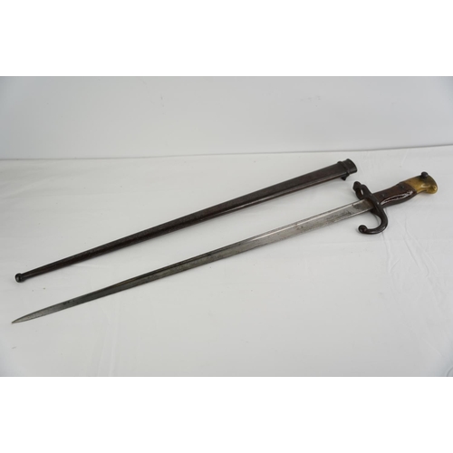 348 - An antique French 1881 Bayonet in original metal scabbard.