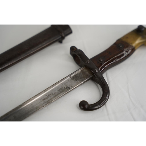 348 - An antique French 1881 Bayonet in original metal scabbard.