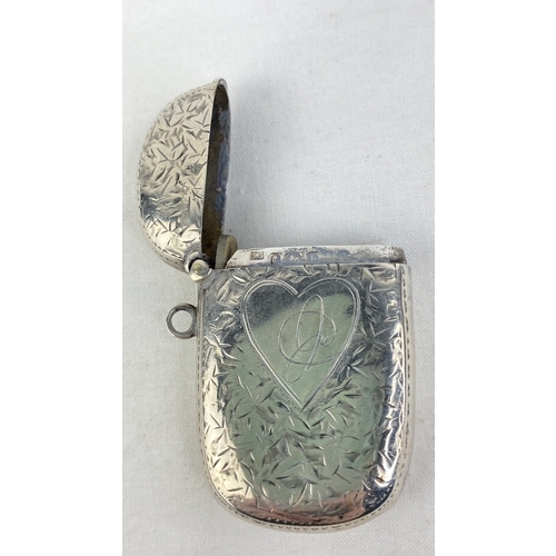 198 - A Sterling silver vesta case with heart design.