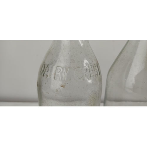 373 - A collection of vintage glass milk bottles.