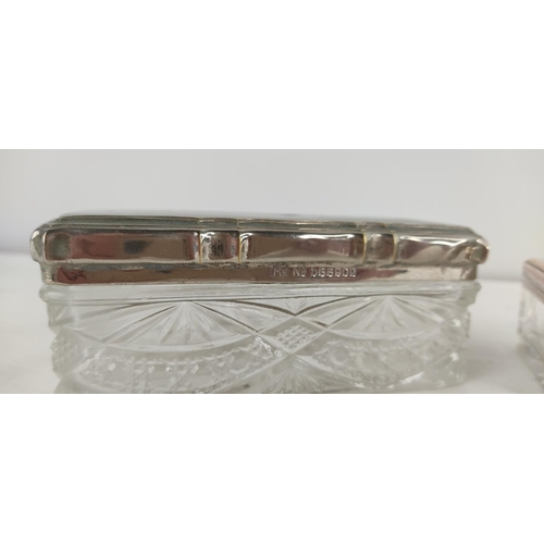 377 - 2 antique/ vintage glass trinket boxes with silver plated lids.