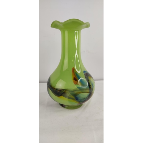 380 - A decorative vintage green glass vase.