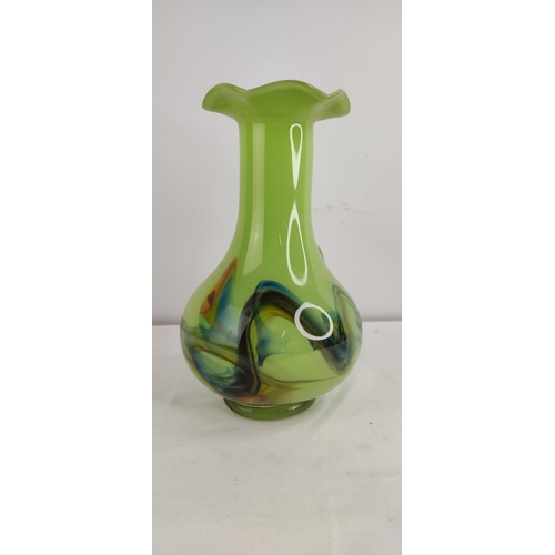 380 - A decorative vintage green glass vase.