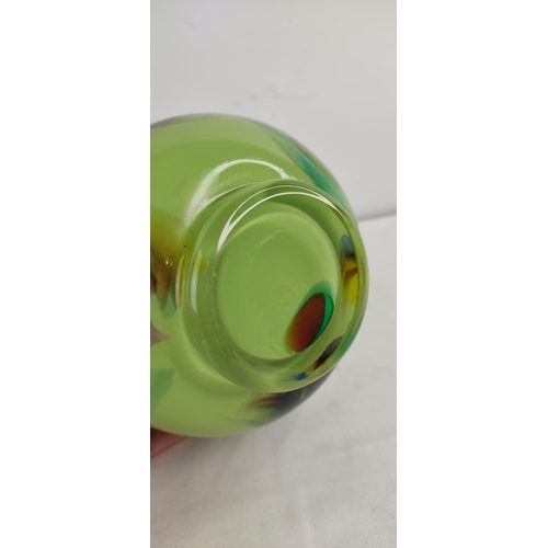 380 - A decorative vintage green glass vase.