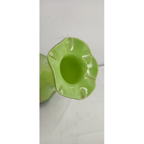 380 - A decorative vintage green glass vase.