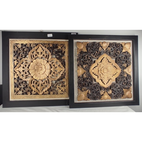 386 - A pair of large decorative wooden panels.